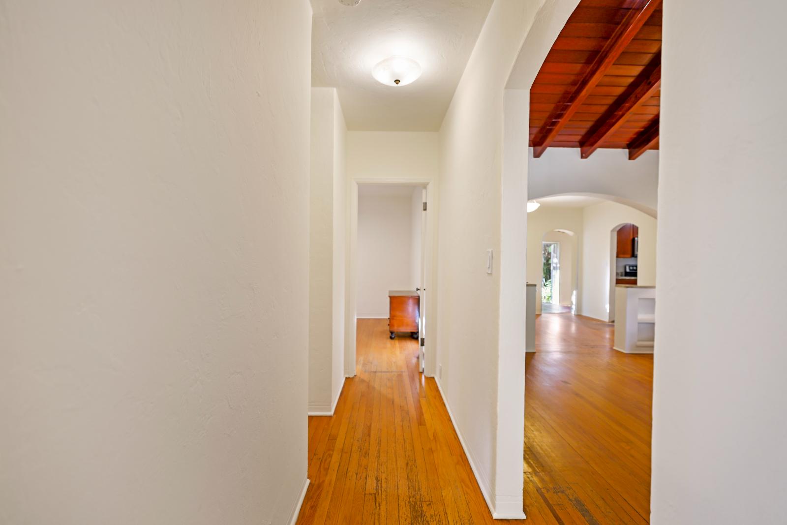 Hallway transition space connecting the bedrooms and bath