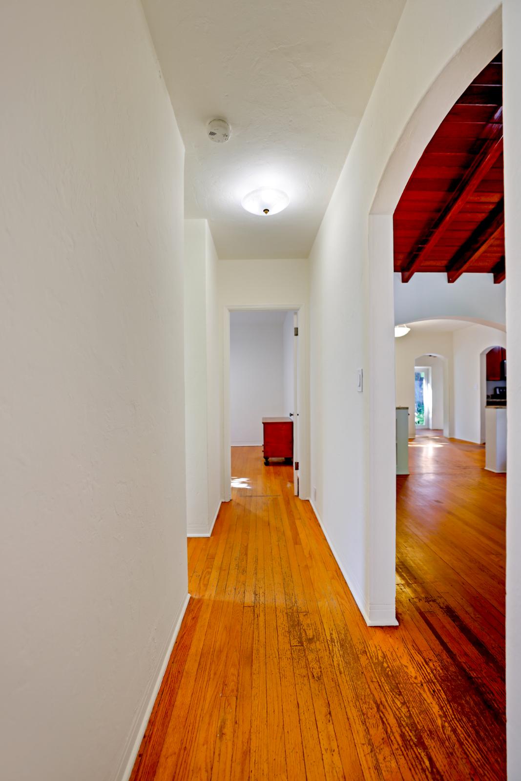 Vertical hallway angle showing interior circulation and natural light