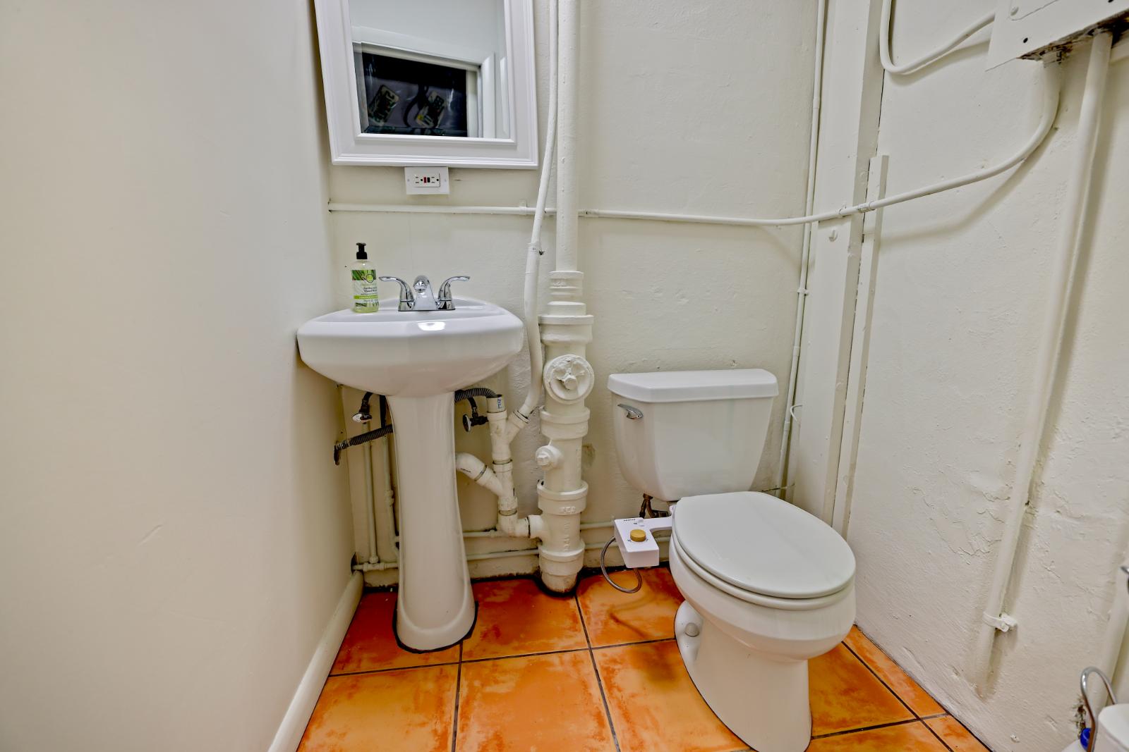 Powder room angle with vintage finishes and compact layout